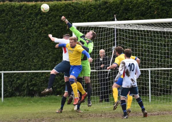 Action from promotion-chasing ON Chenecks' 2-0 win over Potton United last weekend
