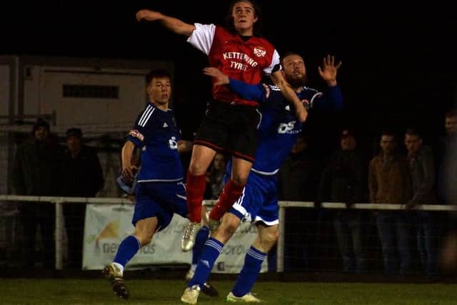 Ben Stephens, who hit Kettering's fifth goal, gets up for a header at Latimer Park