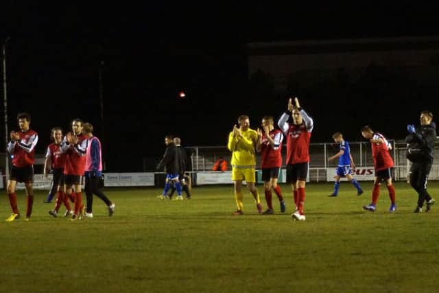 The Kettering Town players applaud their fans following the 7-0 demolition of Bideford at Latimer Park. Pictures by Peter Short