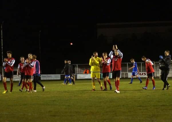 The Kettering Town players applaud their fans following the 7-0 demolition of Bideford at Latimer Park. Pictures by Peter Short