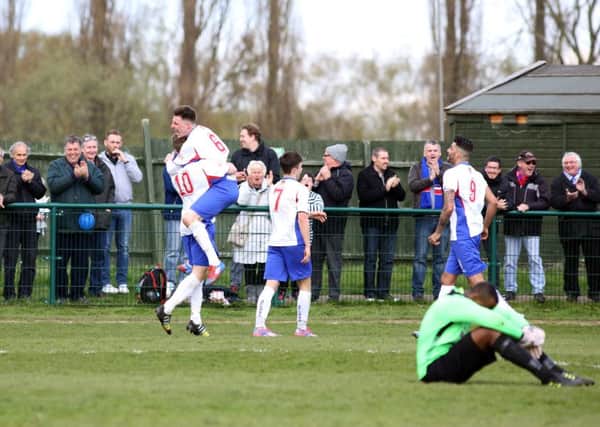 AFC Rushden & Diamonds celebrate Jack Bowen's goal, which completed the 2-0 win over Godalming Town at the weekend