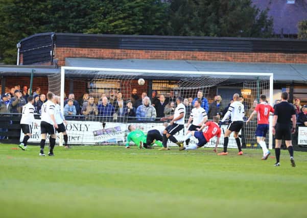 Jack Bowen scores AFC Rushden & Diamonds' opening goal in the 2-1 play-off success at Royston Town. Picture by Kevin Richards