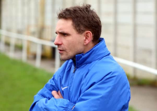 Jon Mitchell's Wellingborough Town need just one more point to confirm their UCL Premier Division status