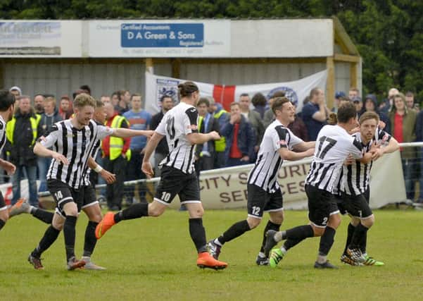 Ben Seymour-Shove takes the congratulations after scoring St Ives Town's winner in the play-off final success over AFC Rushden & Diamonds. Pictures by Duncan Lamont