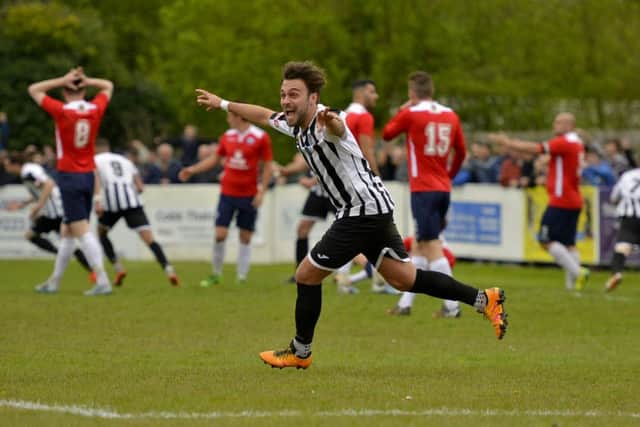 The AFC Rushden & Diamonds players show their disappointment in the background after St Ives Town scored their late equaliser in the play-off final. Pictures by Duncan Lamont