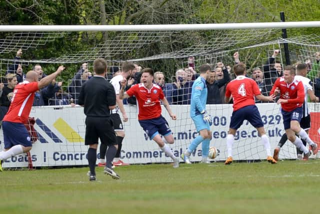 Elliot Sandy (far right) heads off to celebrate after scoring Diamonds' goal
