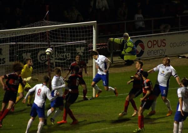 Jack Ashton powers home the stoppage-time head that won the NFA Hillier Senior Cup for AFC Rushden & Diamonds. Pictures by Peter Short