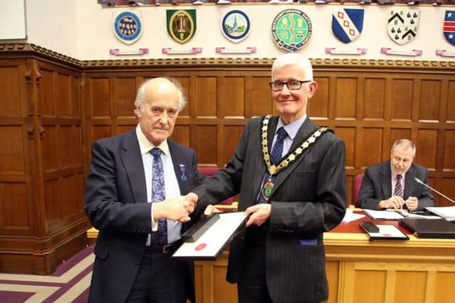 Clive Wood receiving his certificate