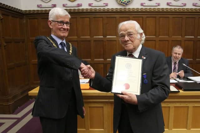 Albert Campbell receiving his certificate