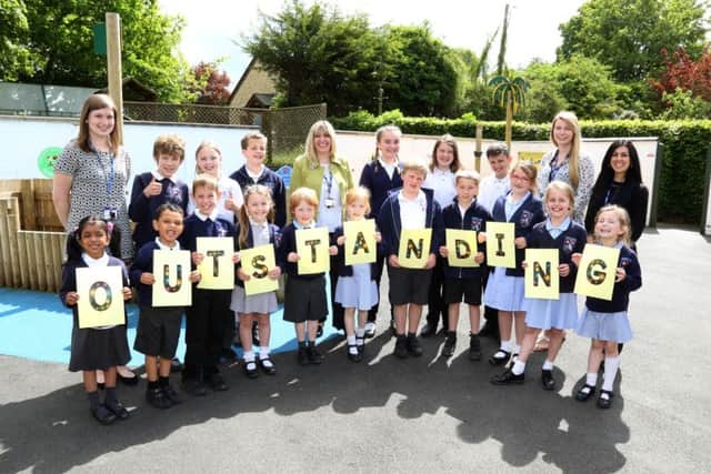 Outstanding Ofsted: Cranford: Cranford Cof E Primary School, Oustanding Ofsted report.
Teaching staff l-r Kirsty Wright (YR teacher), Julie Grey (Head Teacher), Estelle Harding (Yr 1/2), Jessica D'Arienzo (TA) celebrate with pupils
Tuesday May 24 2016 NNL-160524-181346009