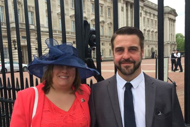 Emergency planning officer Joanne Maddams with her husband Matthew at Buckingham Palace.