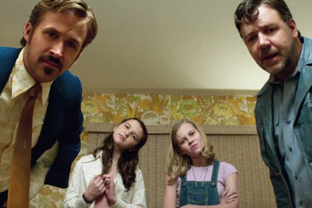 Ryan Gosling as Holland March and Russell Crowe as Jackson Healy