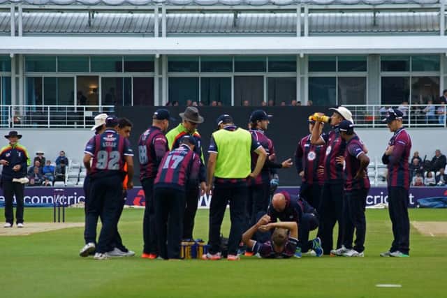 Northamptonshire bowler Olly Stone receives treatment after suffering what has proved to be a season-ending knee injury during last week's T20 Blast win over Worcestershire