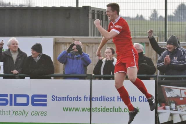 Jake Newman, pictured celebrating a goal for Stamford last season, is set to return to AFC Rushden & Diamonds for the new campaign