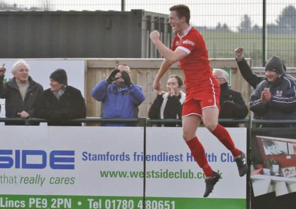 Jake Newman, pictured celebrating a goal for Stamford last season, is set to return to AFC Rushden & Diamonds for the new campaign