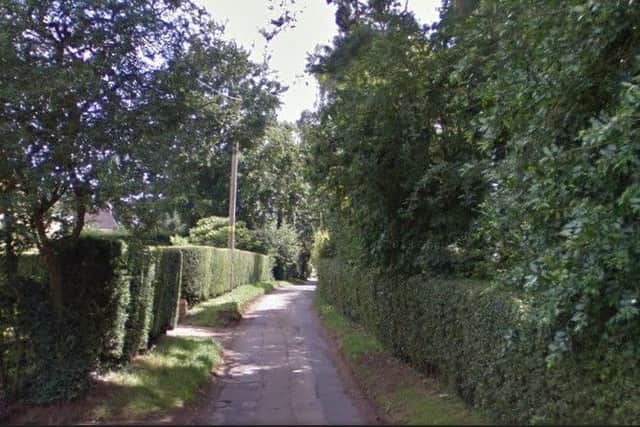 A man indecently exposed himself to a dog walker in fields off Golf Lane, Church Brampton.