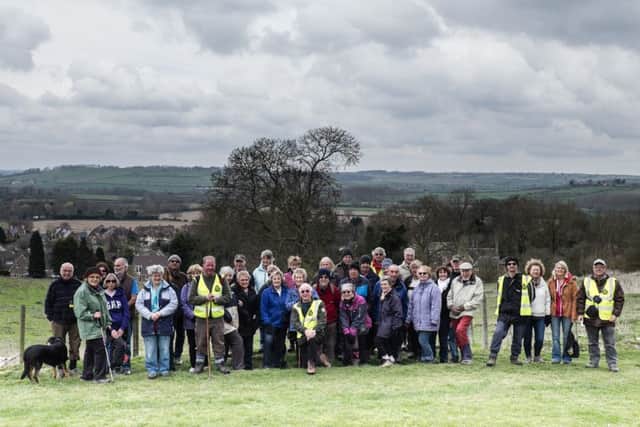 Noel Rogers (front, centre) with members of the East Carlton Health Walking Group on the Jurassic Way, in front of the proposed development site, with views of Cottingham Hall and across the Welland Valley NNL-160630-125435001