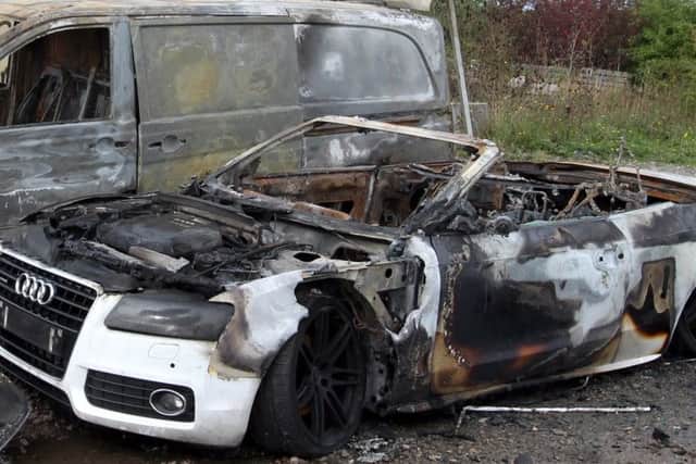 The vehicles which were destroyed by arsonists at the club in 2013
