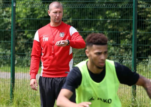 Tommy Wright keeps a watchful eye over proceedings as Corby Town returned for pre-season training. Pictures by Alison Bagley