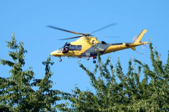 The air ambulance coming into land at Great Billing Way.