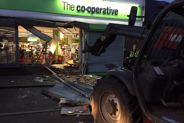 Thieves used a digger to smash into a Co-op in Wollaston and steal a cash machine. Pic by Sgt Darron Bishop