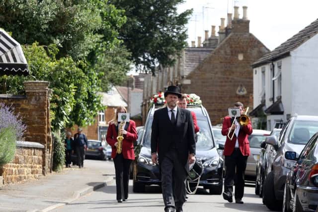 A band led the cortege along High Street, Finedon