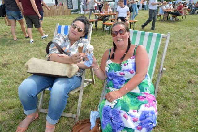 Enjoying the sun...Lisa Barrows and Leigh Howell during the food festival at Kelmarsh Hall.
PICTURE: ANDREW CARPENTER