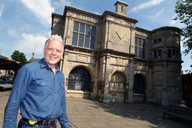 Alan Mills in front of the Market House, Rothwell, in 2010