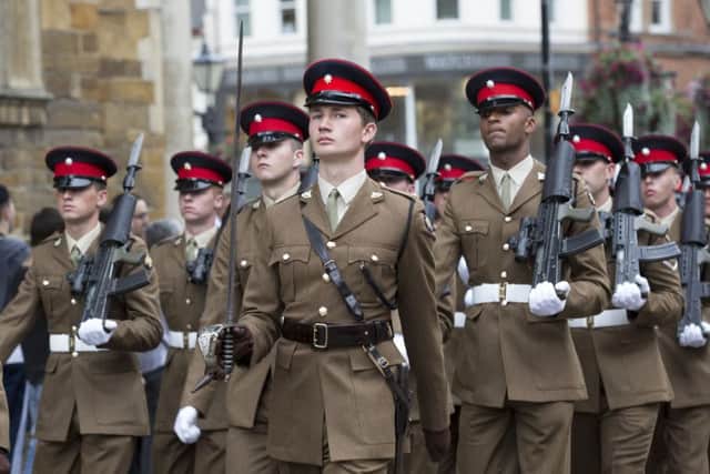 Soldiers from The Poachers parade through Northampton before laying up their Regimental Colour at Church of the Holy Sepulchre NNL-160730-162555009