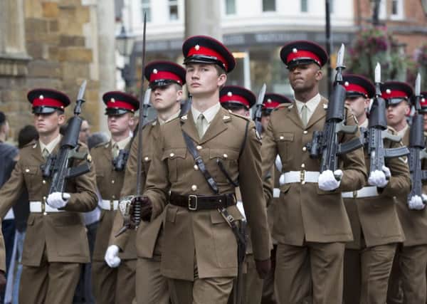 Soldiers from The Poachers parade through Northampton before laying up their Regimental Colour at Church of the Holy Sepulchre NNL-160730-162555009