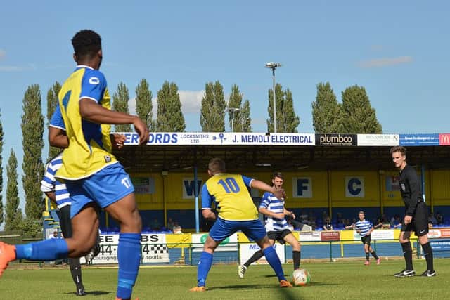 Action from Wellingborough Town's defeat to Stotfold in the FA Cup at the weekend. The Doughboys begin their league season against Eynesbury Rovers this evening. Picture by Jim McAlwane