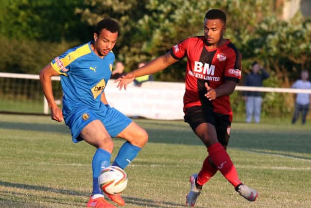Kettering's Liam Bateman challenges Leamington's Rob Thompson-Brown during the Poppies' 2-0 defeat at Latimer Park. Pictures by Steven Prouse
