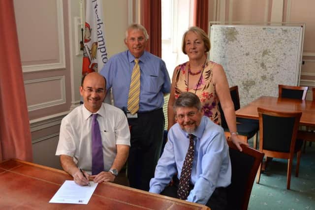Professor Simon Denny and Cllr Andre Gonzalez De Savage signing the agreement