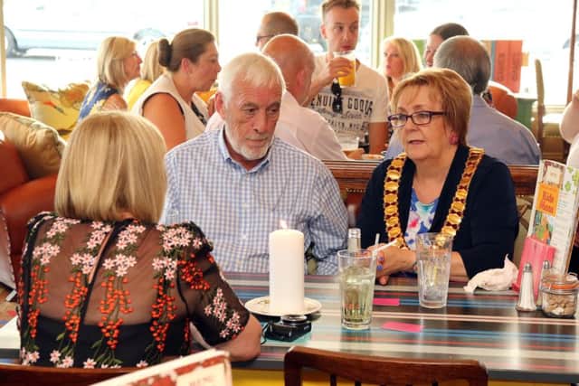 Mayor of Corby Julie Riley enjoys some tasty food with her party at the bar opening
