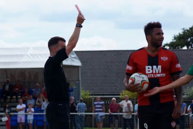 Rene Howe shows his surprise after being shown a red card during Kettering Town's 0-0 draw with Hitchin Town at Latimer Park. Pictures by Peter Short
