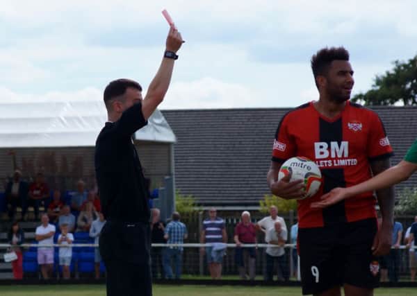 Rene Howe shows his surprise after being shown a red card during Kettering Town's 0-0 draw with Hitchin Town at Latimer Park. Pictures by Peter Short