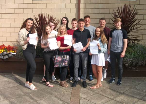 Students at Brooke Weston with their A-level results
