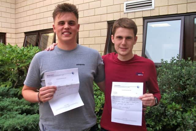 Billy Snaith and Henry Griffiths with their results
