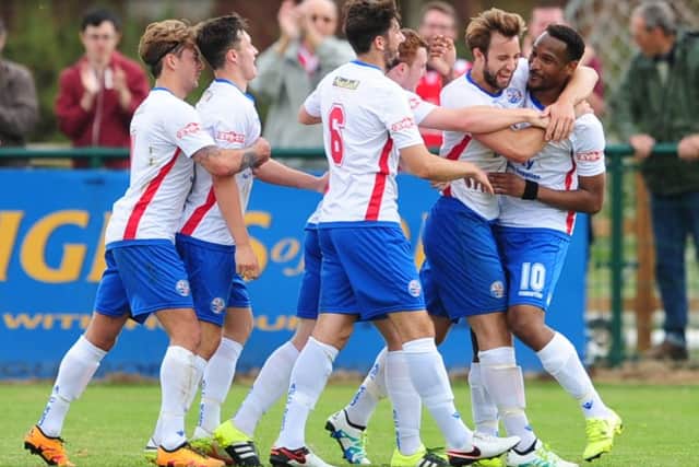 Nabil Shariff is mobbed by his team-mates after scoring his second goal during AFC Rushden & Diamonds' 4-3 FA Cup win over Sileby Rangers. Pictures by Mike Capps/www.kappasport.co.uk