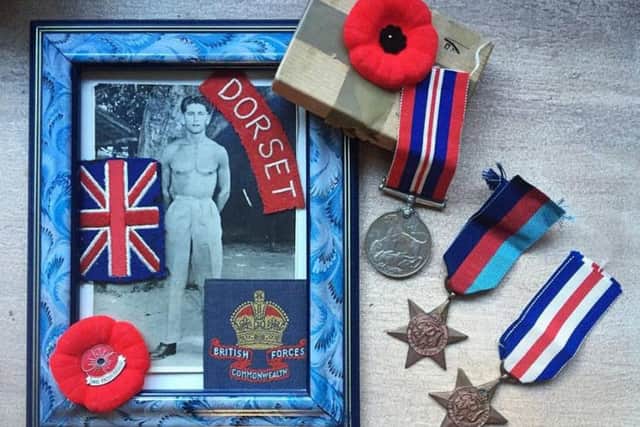 A photo of Raymond Moore and his medals