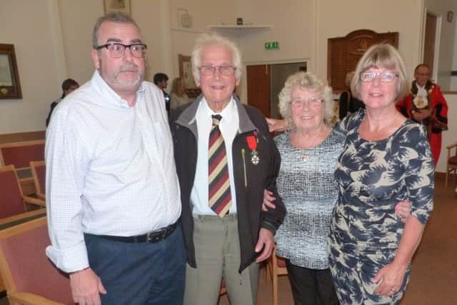 Mr Moore with family and friends after the presentation