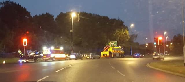 Police and fire crews attending an incident at the Bedford Road roundabout last night. To the left of the image a boat crew is visible. Submitted picture.