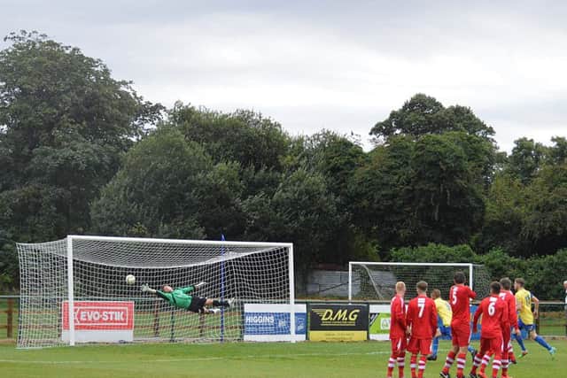 Jack Wisniewski's strike finds the net during Wellingborough Town's 3-0 win over Boston Town last weekend. Picture by Jim McAlwane