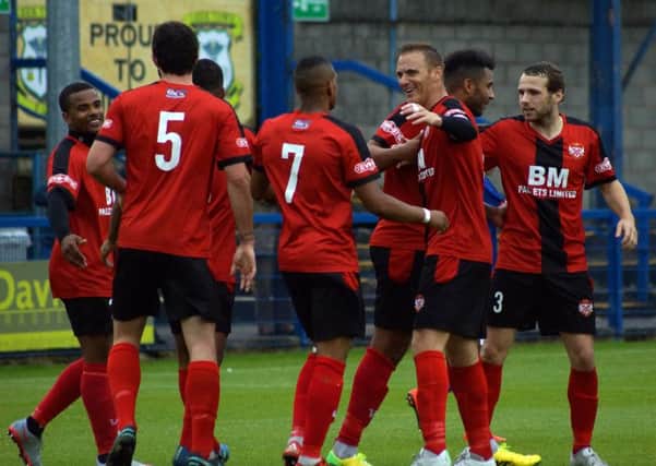 Kettering Town's players celebrate one of their goals during the 3-2 victory at Leek Town. Pictures by Peter Short