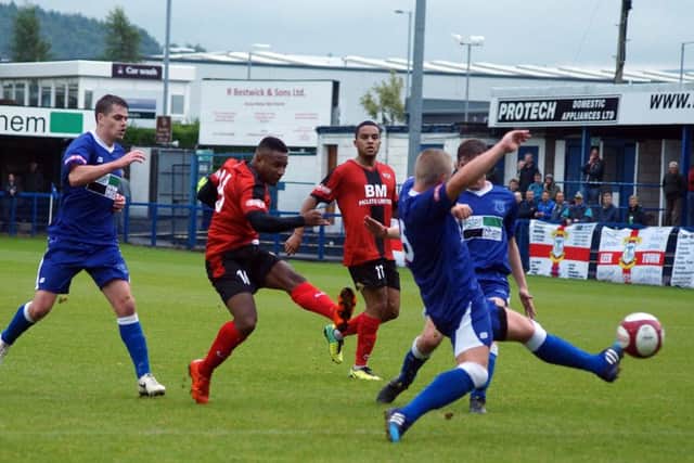Aaron O'Connor fires home Kettering Town's dramatic winner in the 3-2 FA Cup success at Leek Town. Pictures by Peter Short