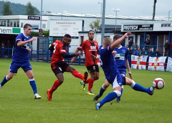 Aaron O'Connor fires home Kettering Town's dramatic winner in the 3-2 FA Cup success at Leek Town. Pictures by Peter Short