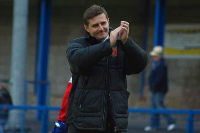 Poppies boss Marcus Law applauds the travelling fans