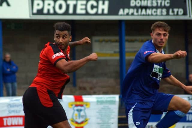 Rene Howe heads home Kettering Town's opening goal in the FA Cup win at Leek Town