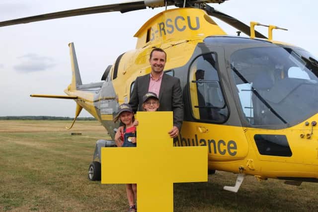 James Woodgate pictured with daughters Mollie, aged 8, and Ellie, aged 6.