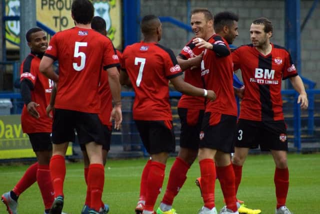 Kettering Town's players will be hoping to replicate their impressive away form when they return to Latimer Park to take on Banbury United this weekend. Picture by Peter Short